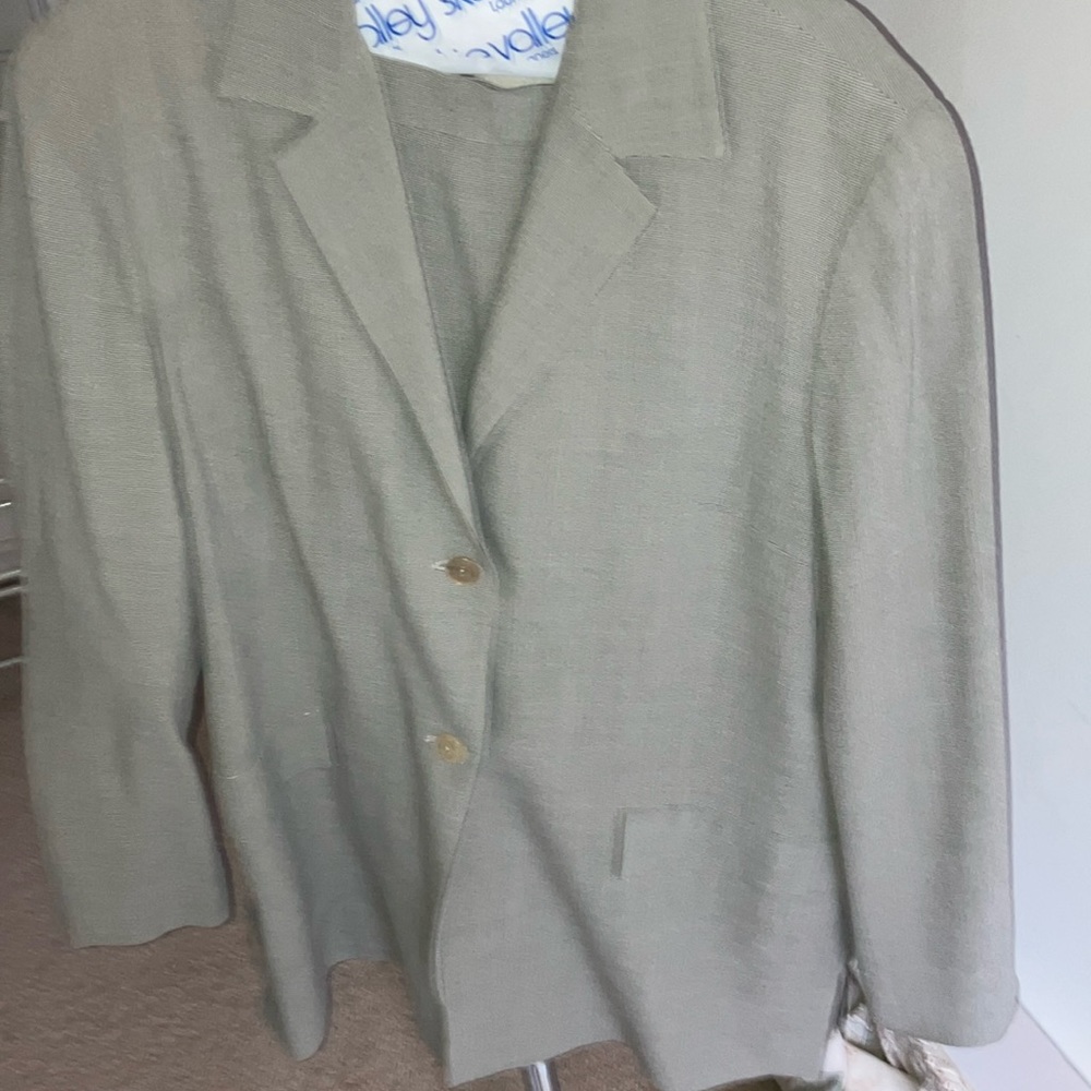 Size 12 Barney’s New York suit. Short skirt light material.